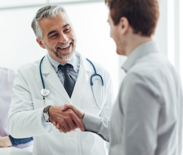 Doctor shaking hand with patient